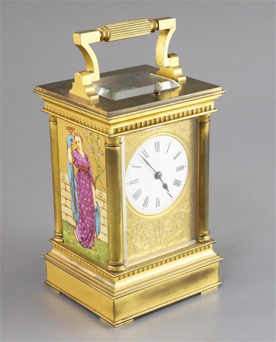 An Edwardian ormolu and porcelain hour repeating carriage clock, height 6.75in., with brown leather travelling case